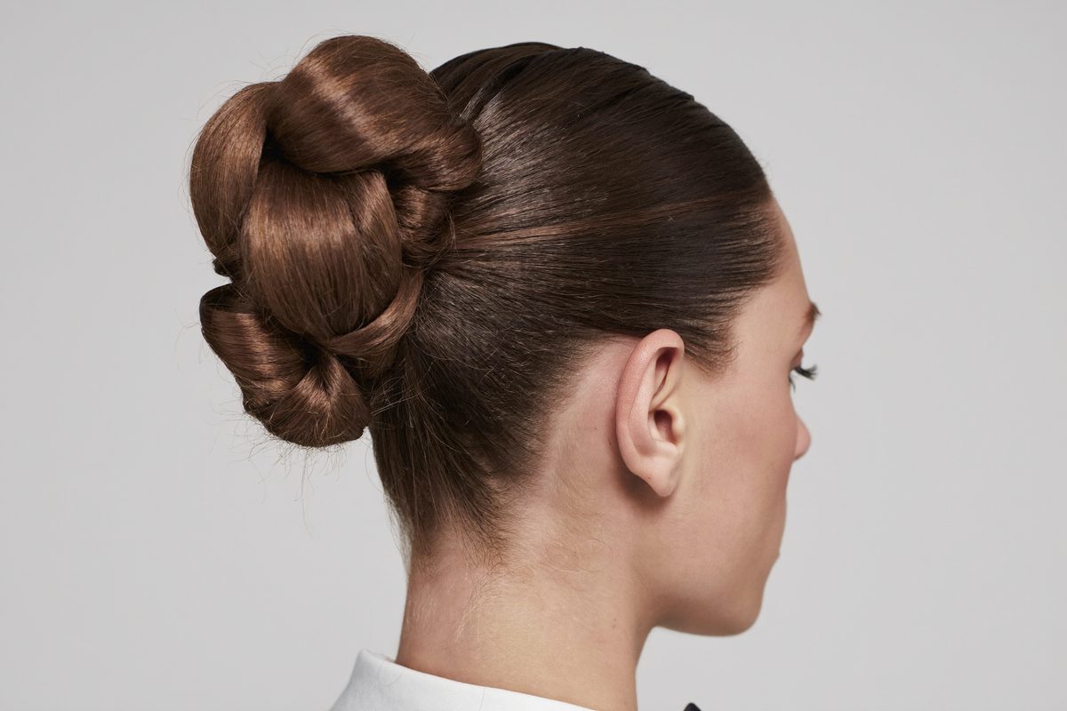 Close-up of a sleek, polished low bun, a classic safe job interview hairstyle