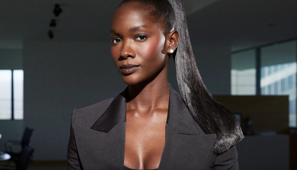 Woman with a sleek high ponytail and sharp side part, a polished statement job interview hairstyle